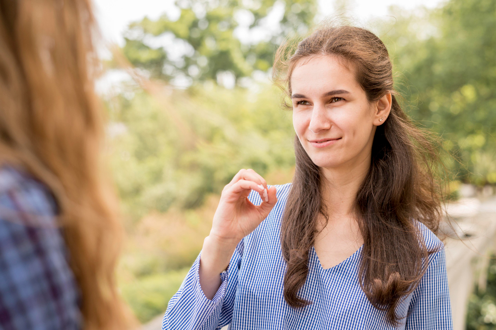 A woman communicating via sign language